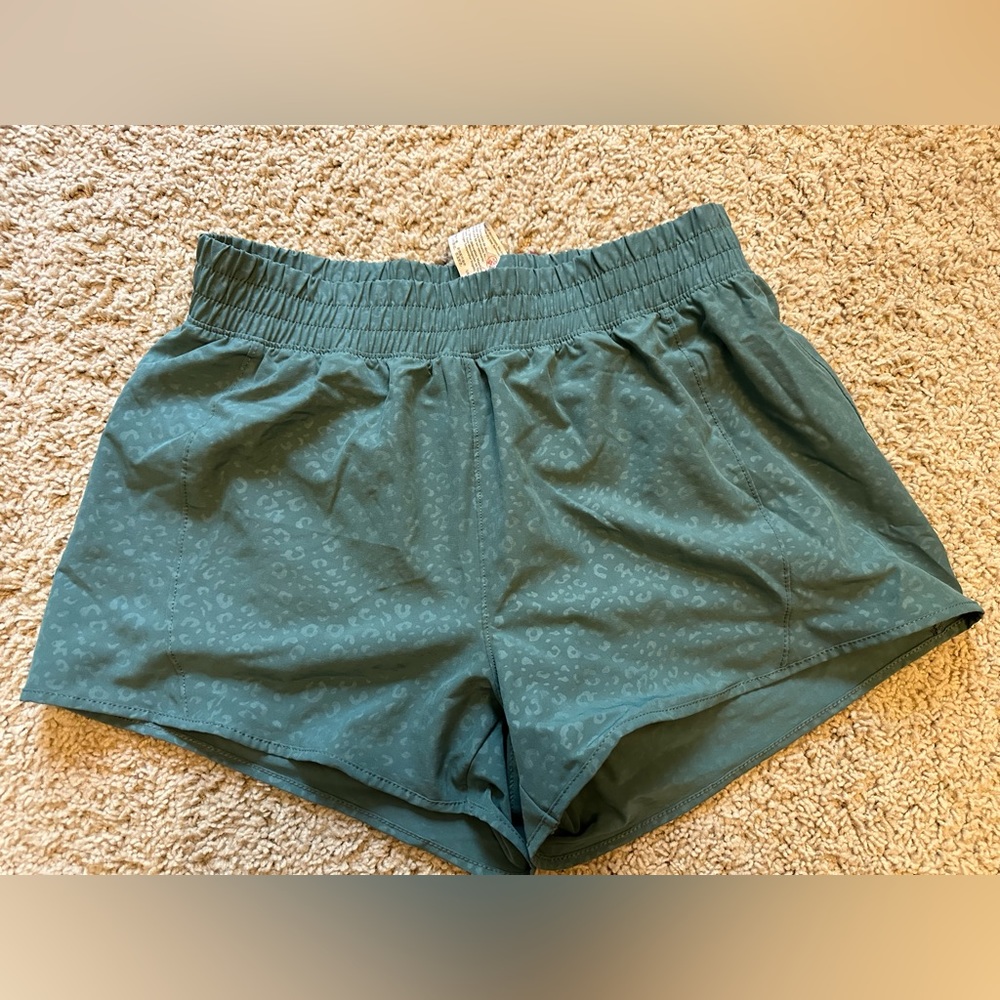 Green running shorts